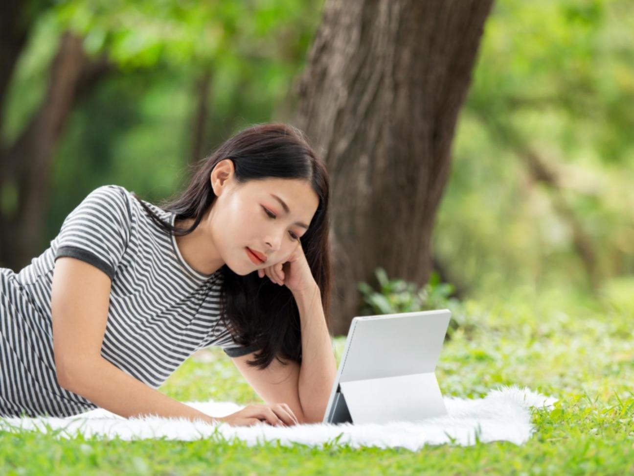 Person reviewing budget notes in comfortable workspace